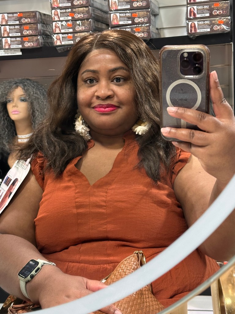 woman in a medium length brown wig