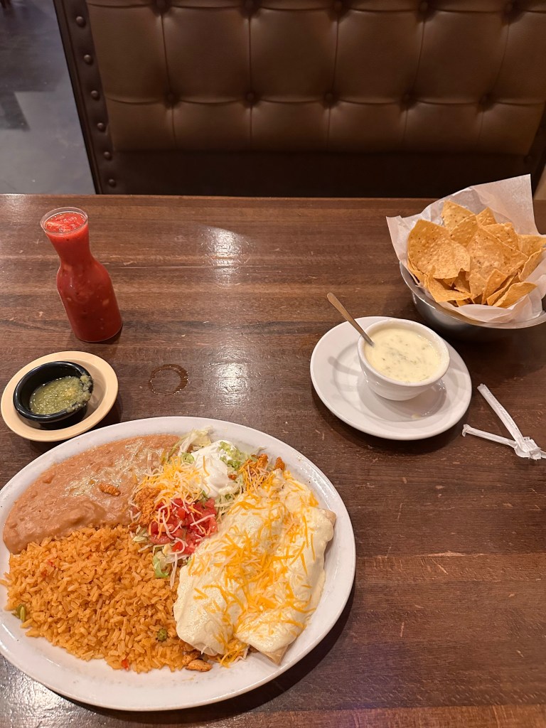 plate of mexican food and queso