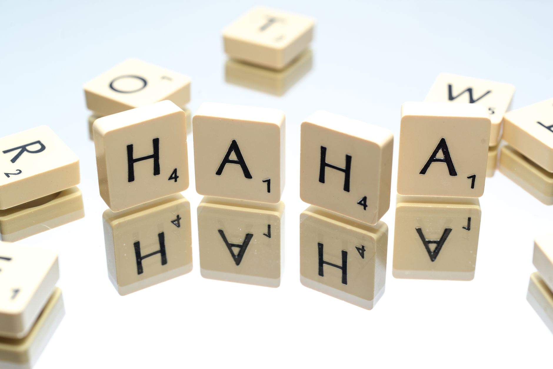 Haha spelled out using scrabble tiles.