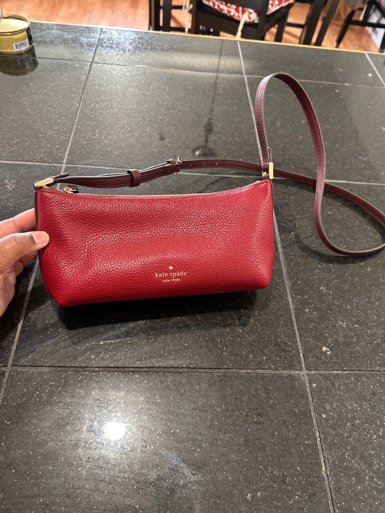 Image of a red Kate Spade purse