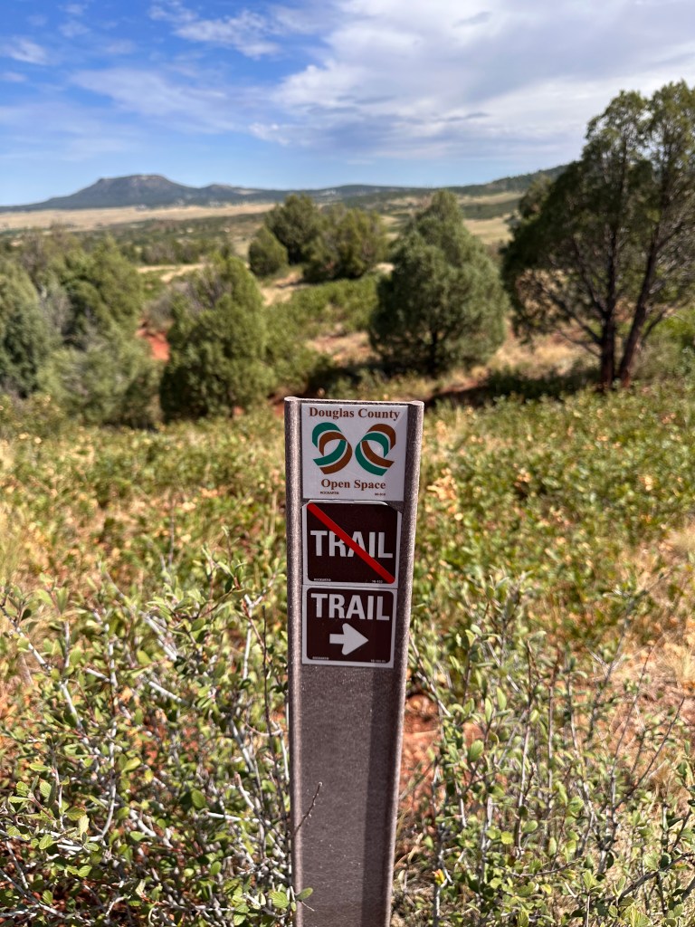 A warning sign in Juniper Valley park near Larkspur, CO